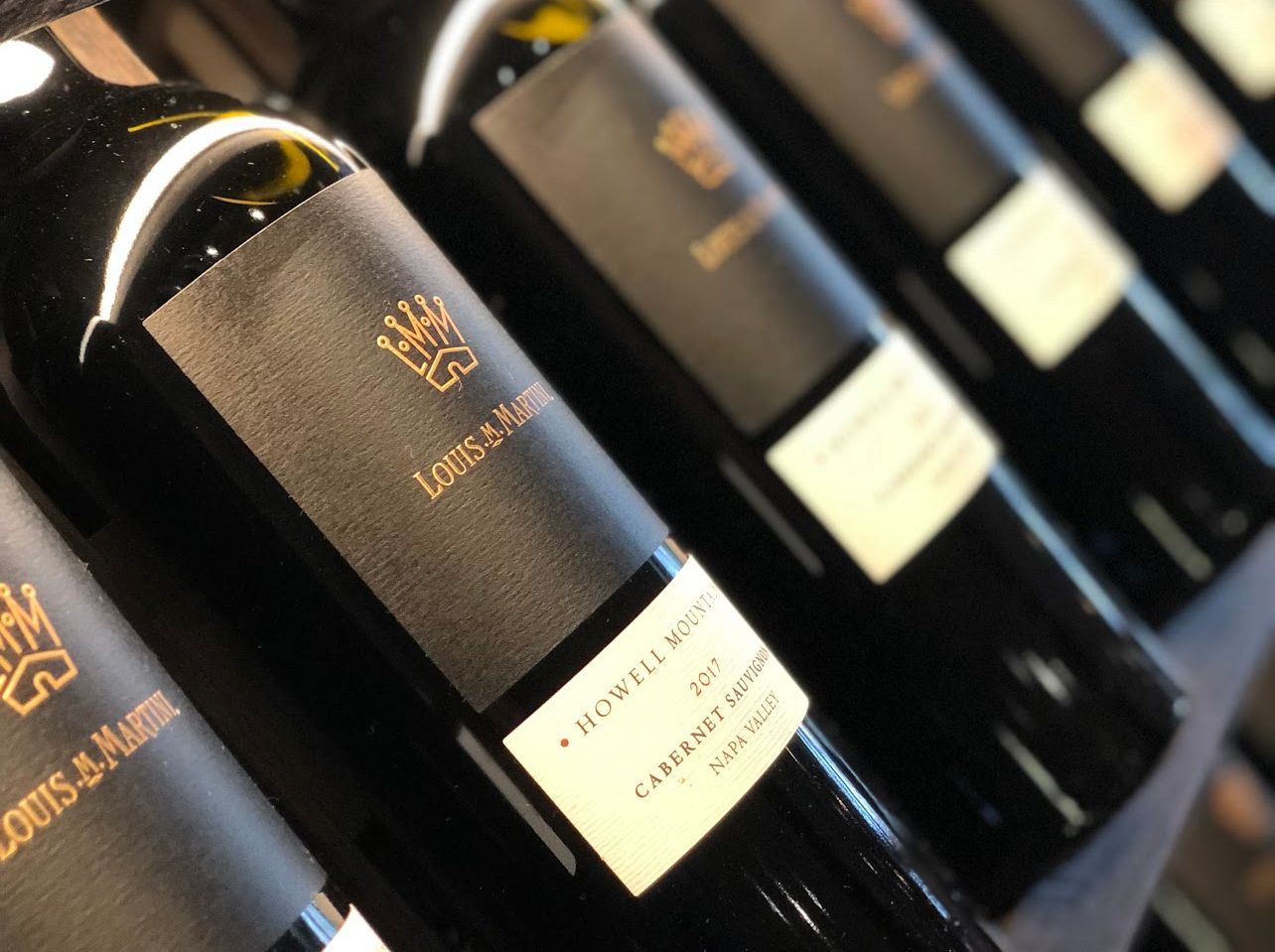 A row of bottles of louis & marie wine