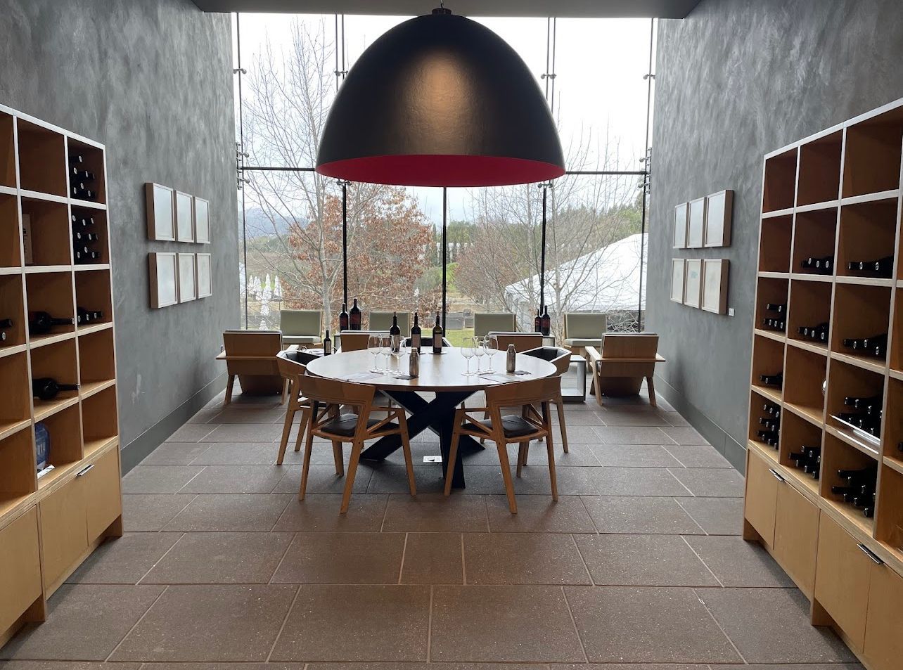 A room with a table and chairs in it