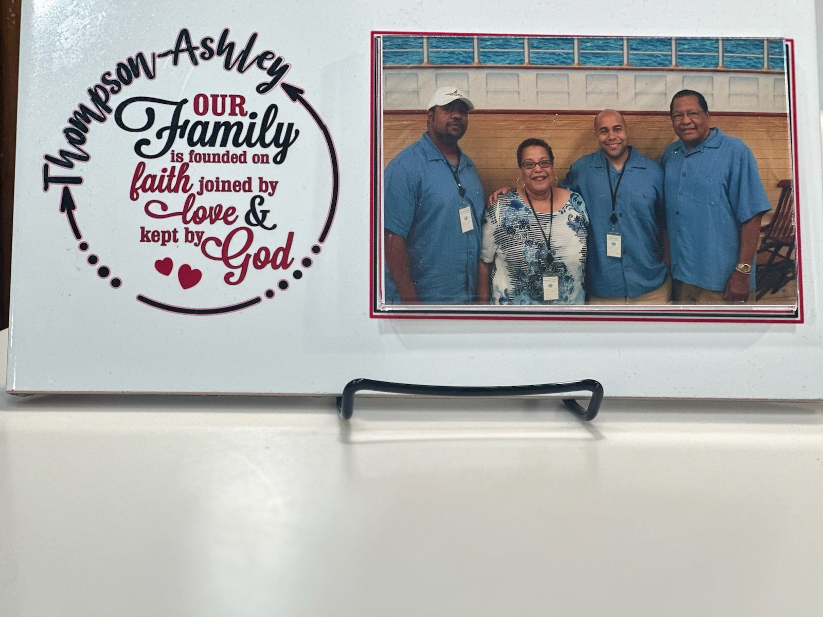 A picture of a family with the words our family faith united to love and kept by god