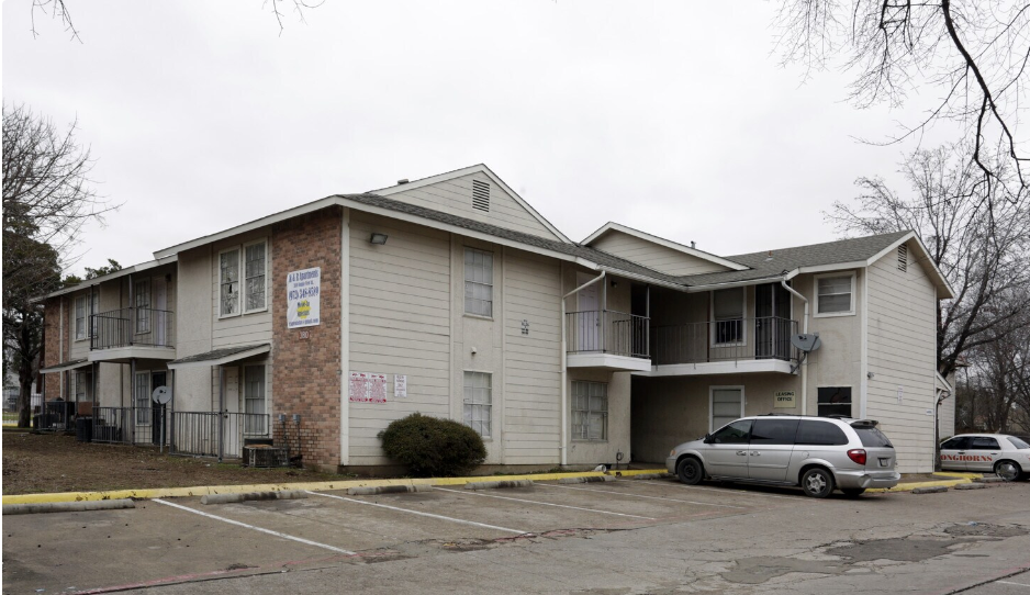 a white van is parked in front of a building that says welcome to plaza