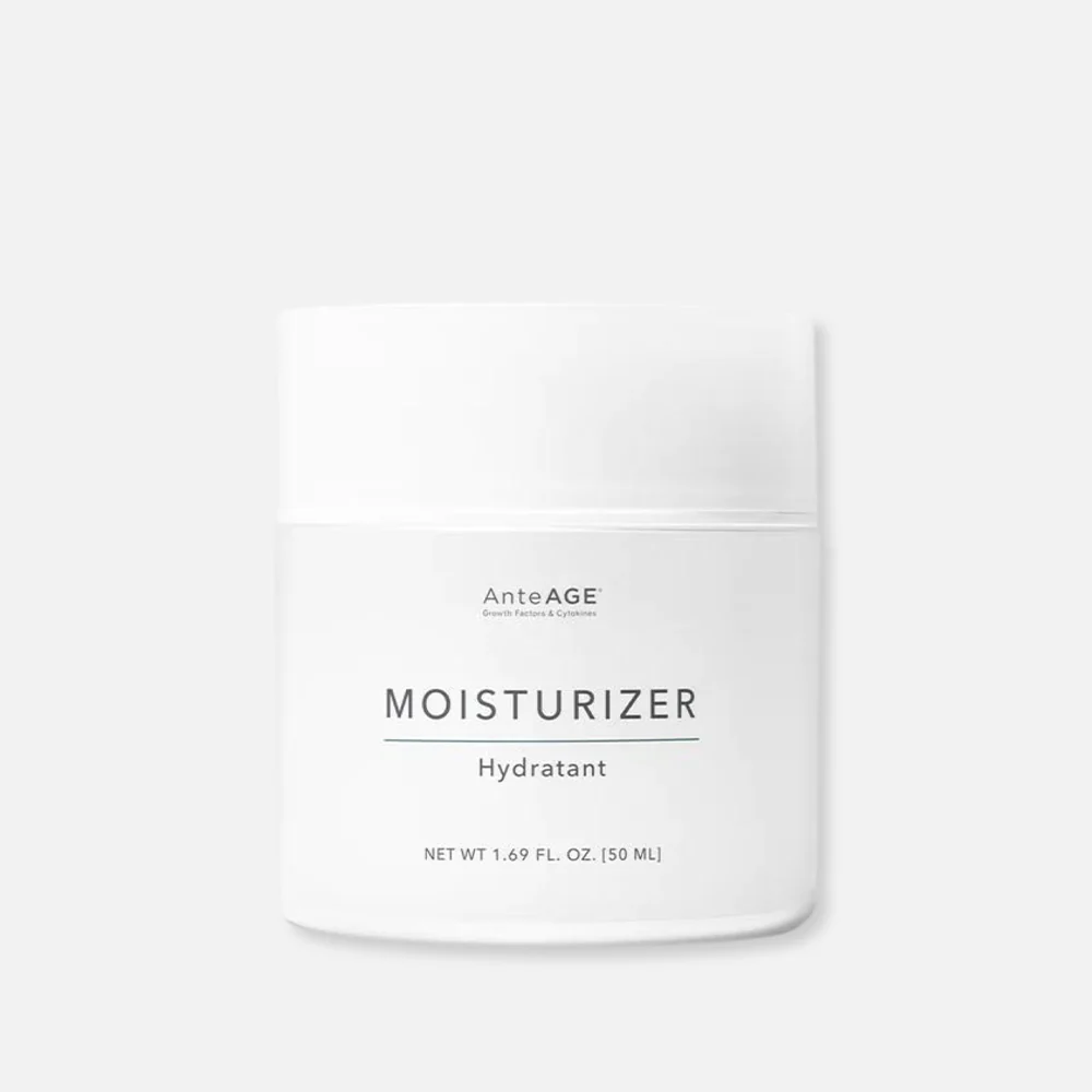 A white jar of moisturizer on a white background.