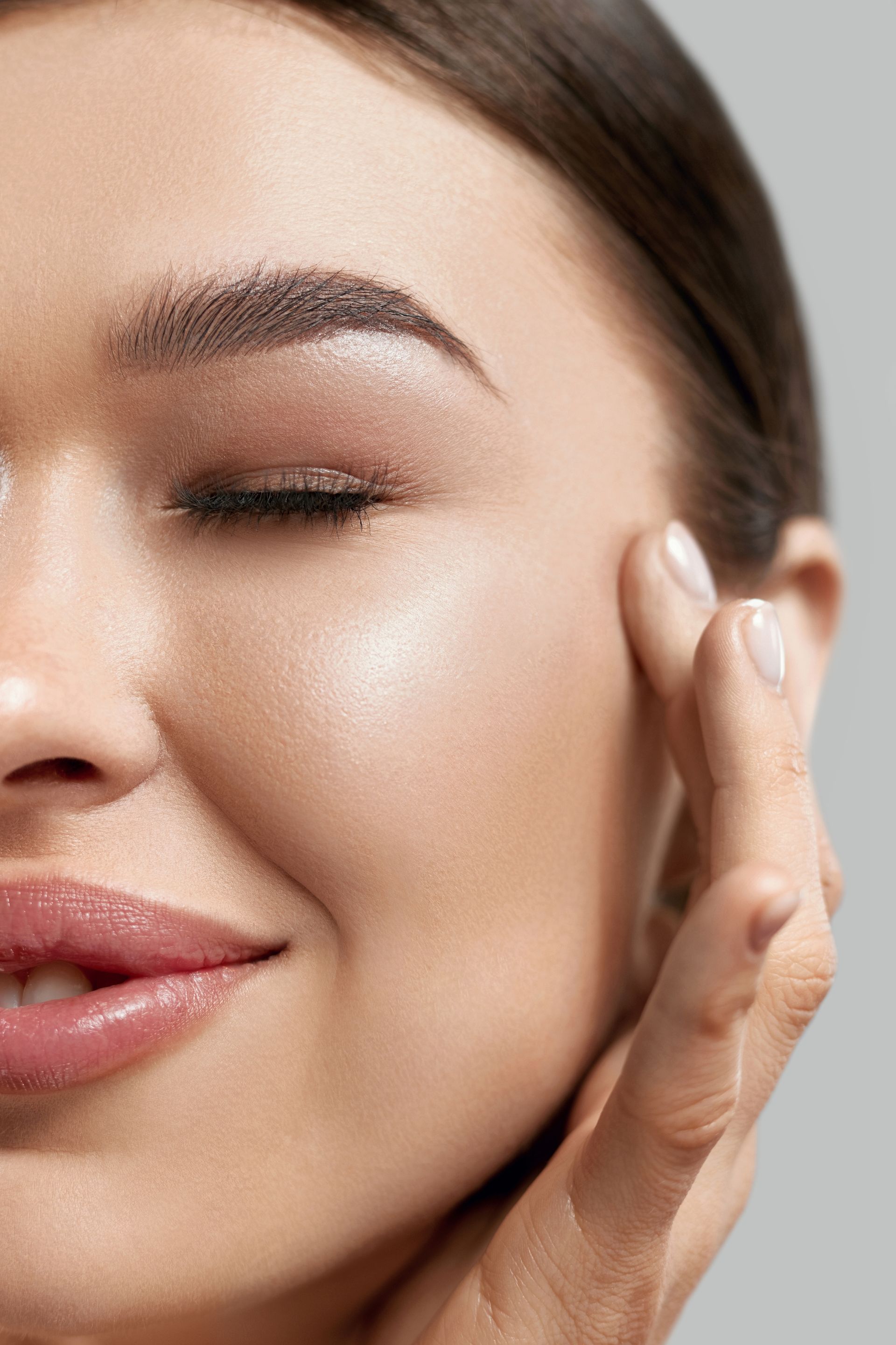 A woman is getting a botox injection in her face.