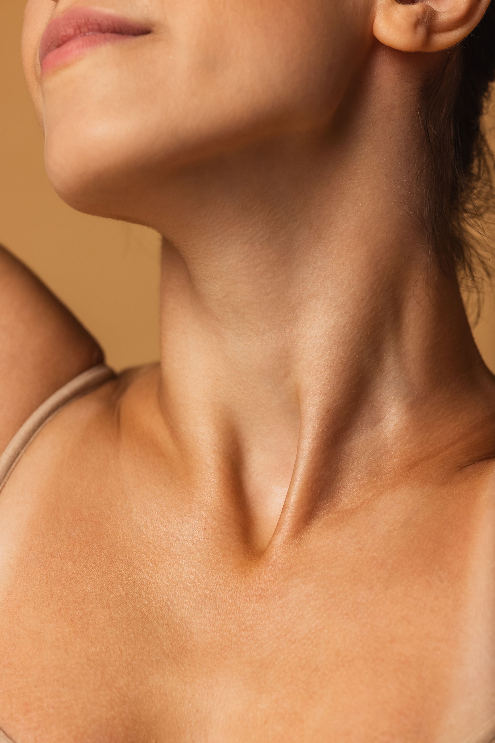 a close up of a woman 's neck and chest