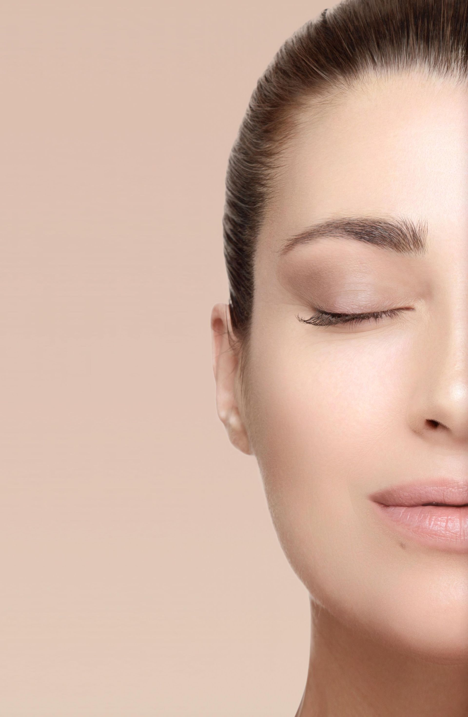 a close up of a woman 's face with her eyes closed