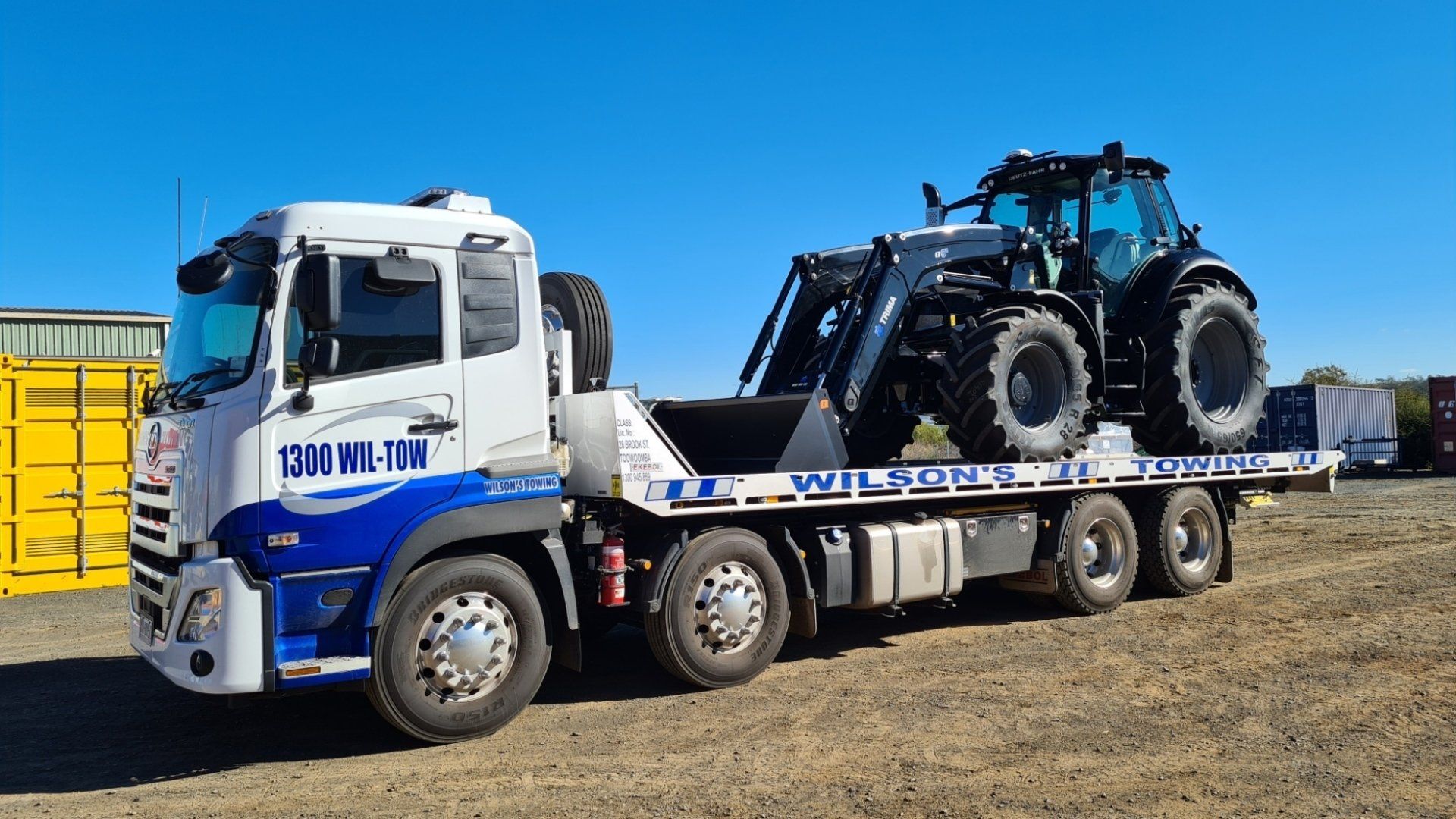 Towing Truck Loaded a Bulldozer — Smash Repairs & Spray Painting in Toowoomba, QLD