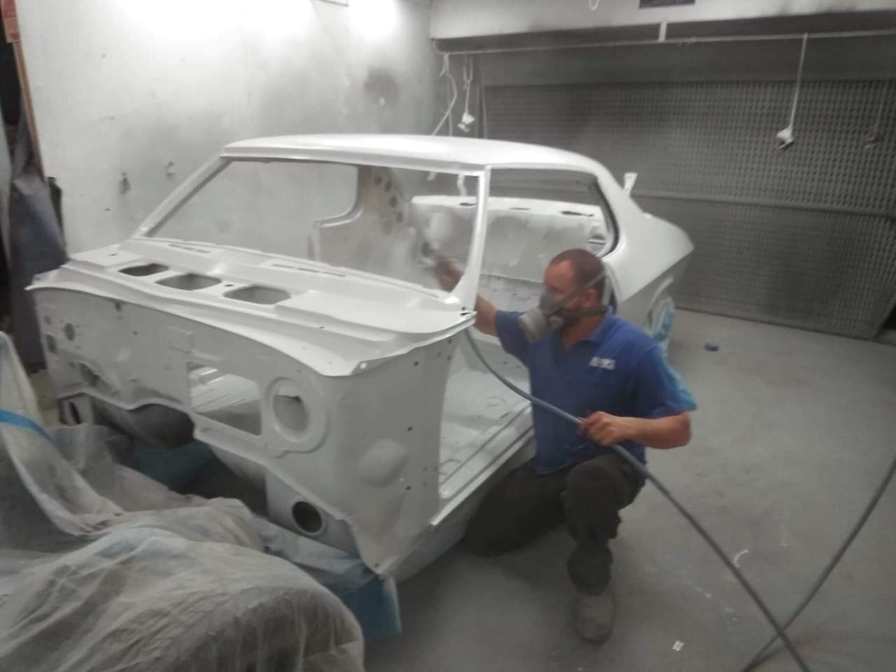 Spraying Paint on a Car Body — Panel Beaters in Toowoomba, QLD