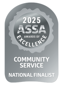 Silver ASSA Awards of Excellence badge: 2025 seal, "Community Service National Finalist" text.