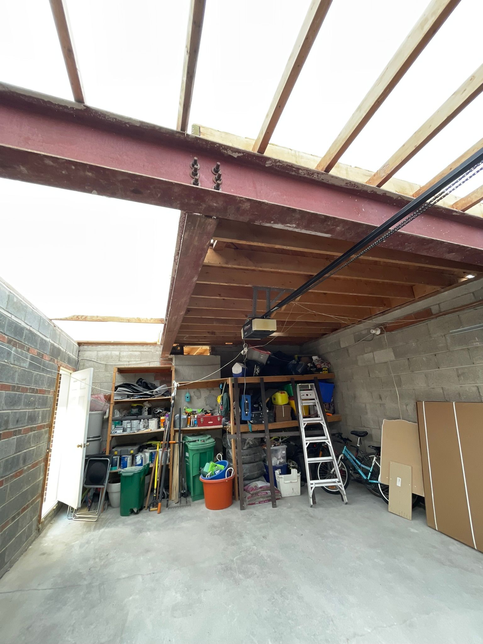 A man is using a drill to drill a hole in a wall.