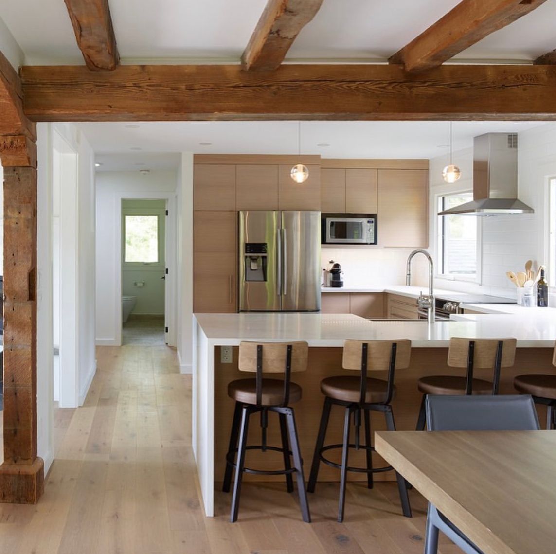 A kitchen with stainless steel appliances and wooden cabinets