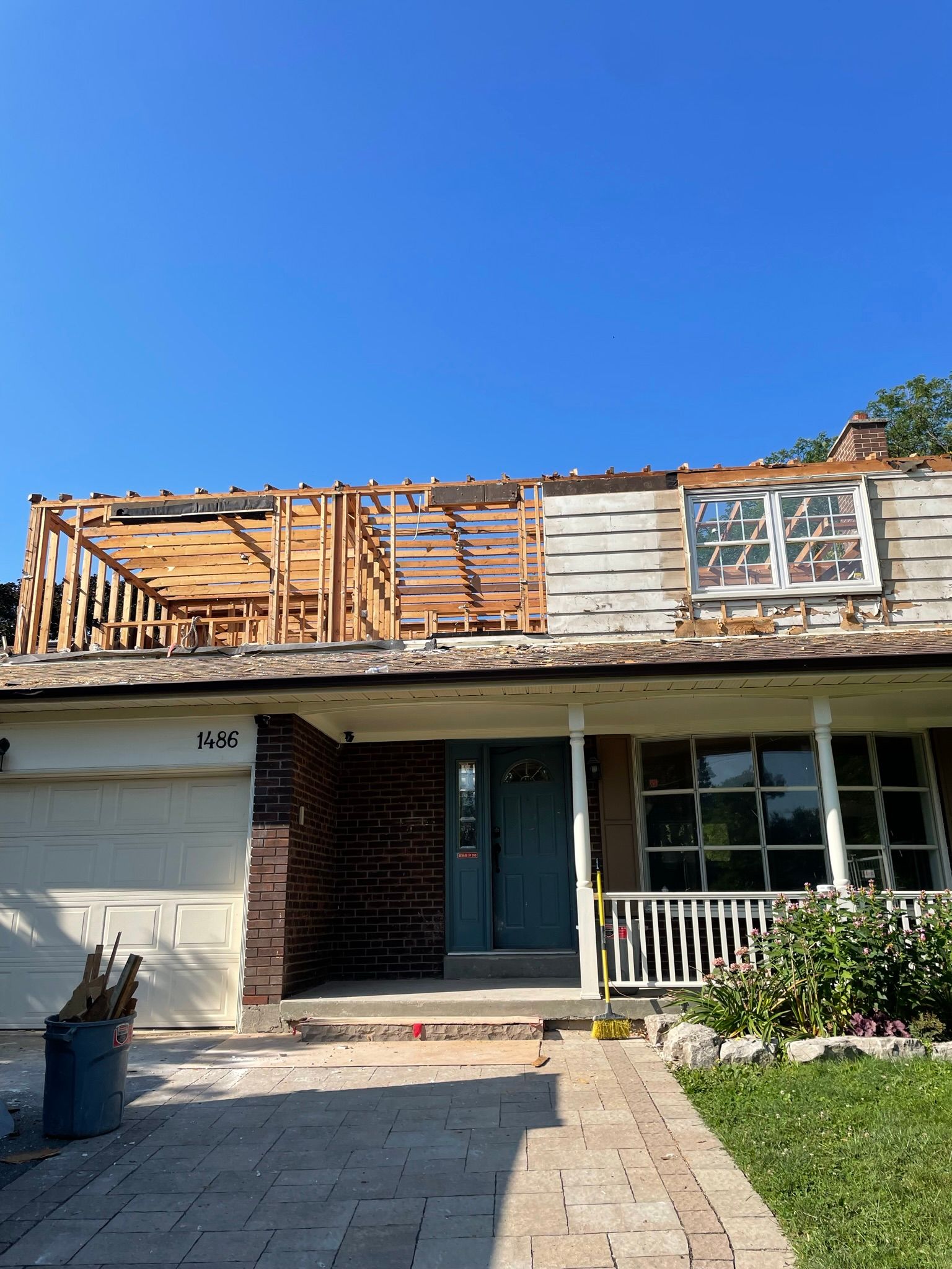 A house with a roof that is being remodeled.