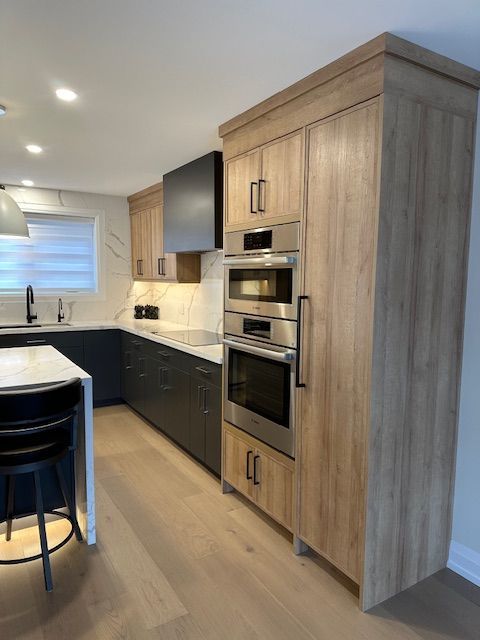 A kitchen with wooden cabinets and stainless steel appliances