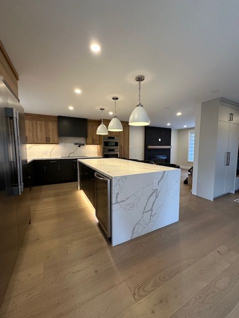 There is a large island in the middle of the kitchen.
