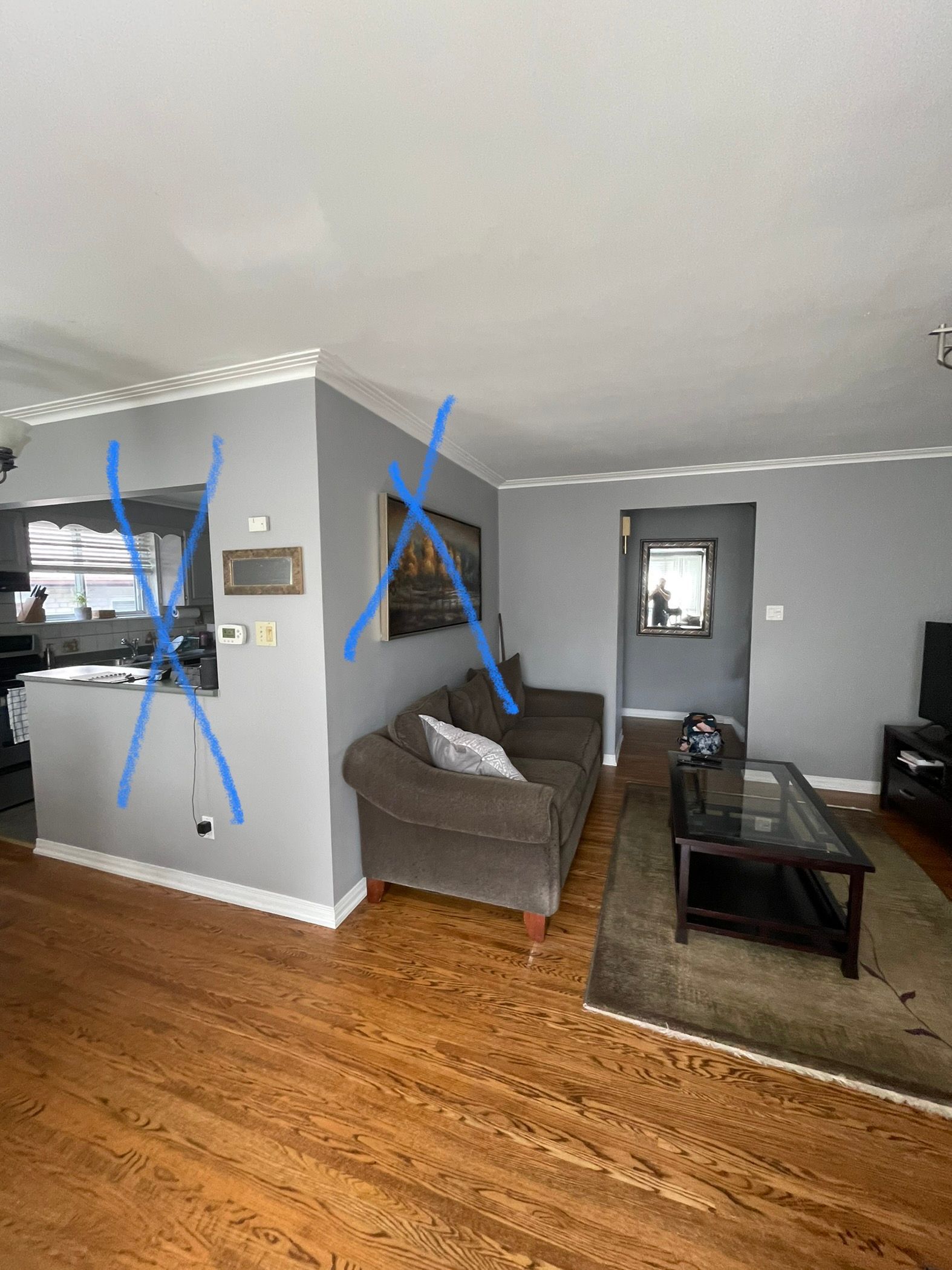 A living room with a couch , coffee table , and rug.