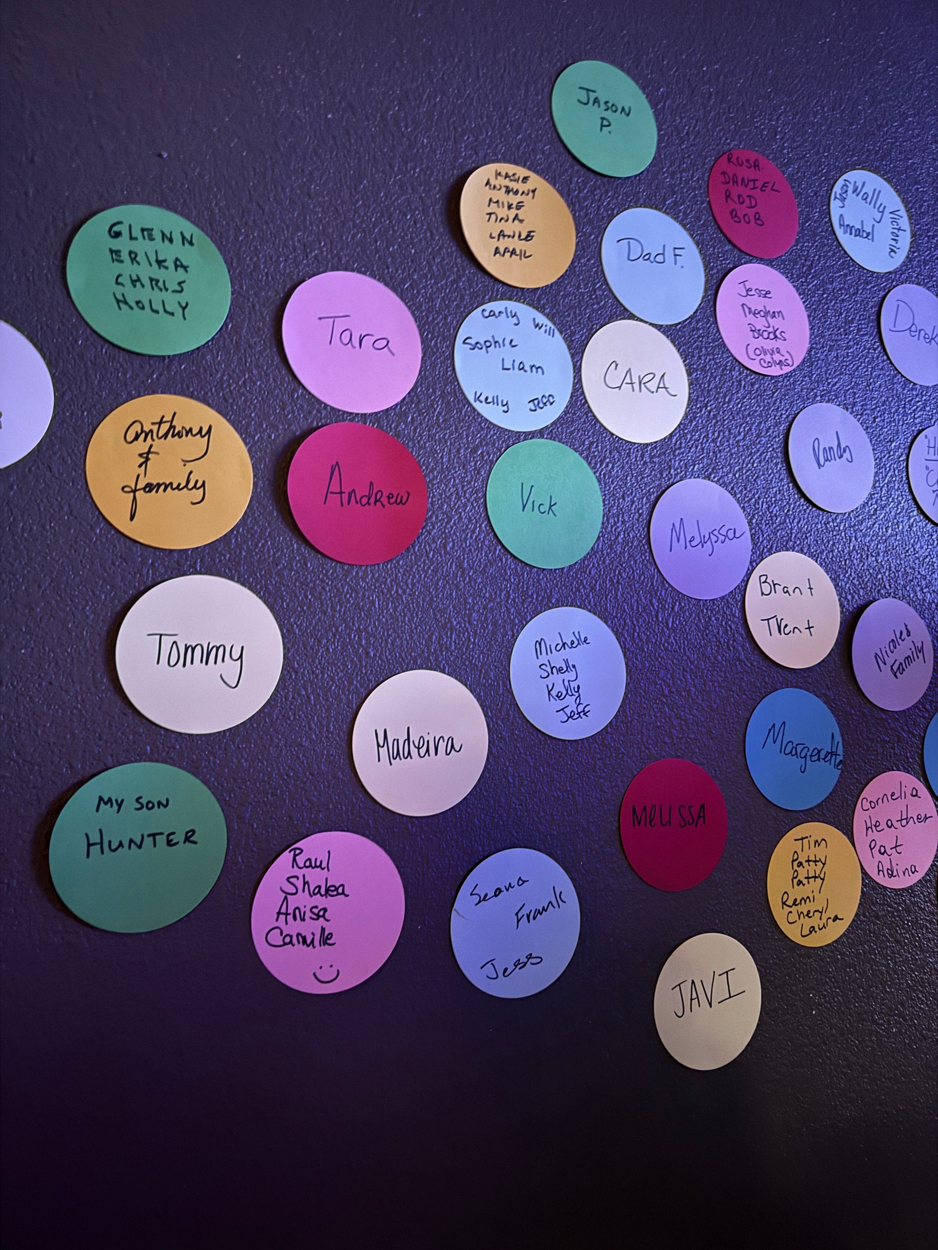 A bunch of colorful circles on a purple surface