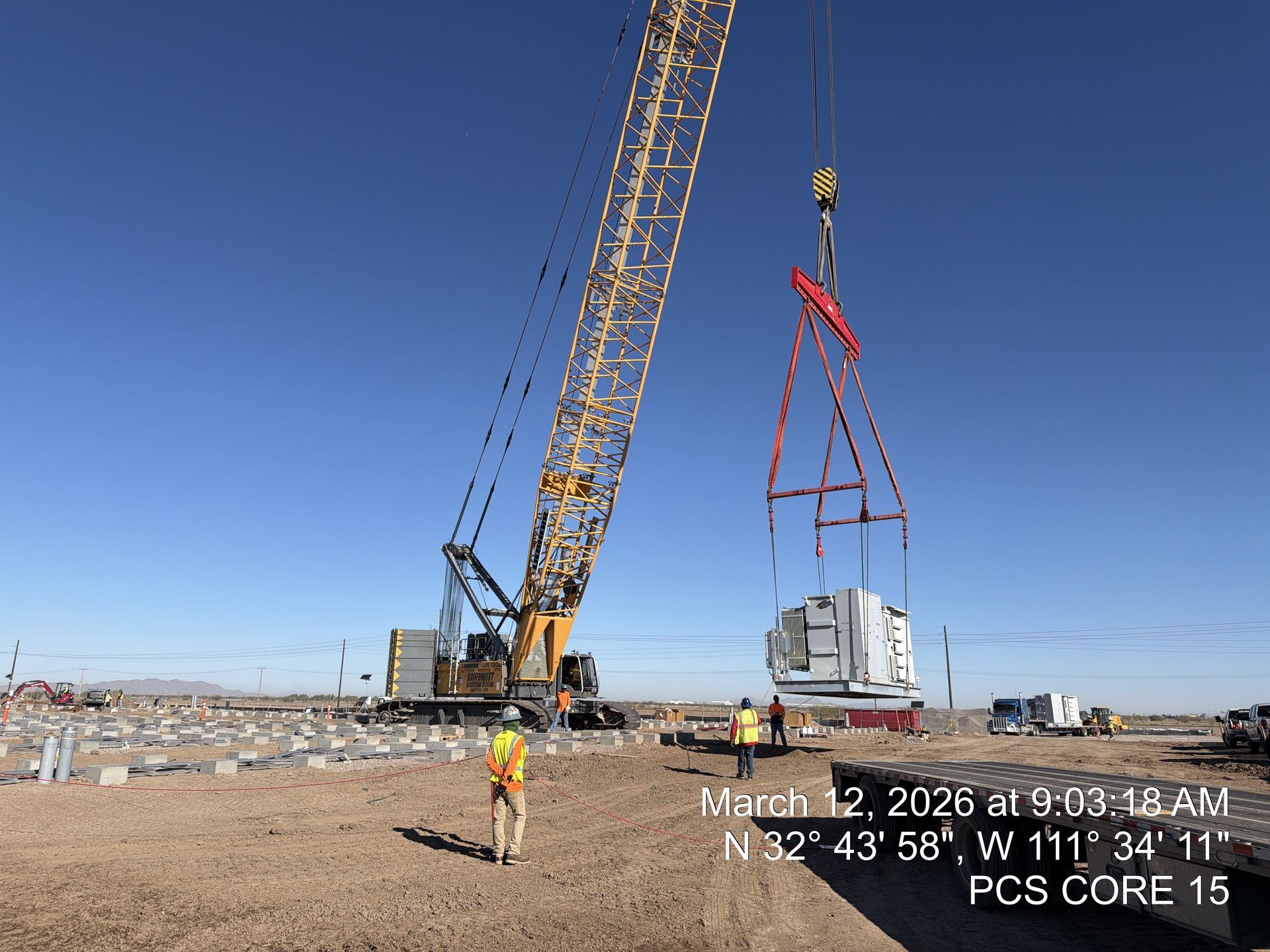 Veteran Crane crawler crane lifting a battery energy storage unit into place at a 100 MW BESS site i