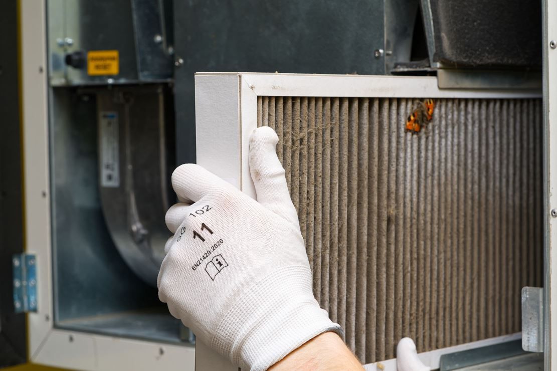 Clean residential outdoor HVAC unit with clear clearance to improve airflow and save money.