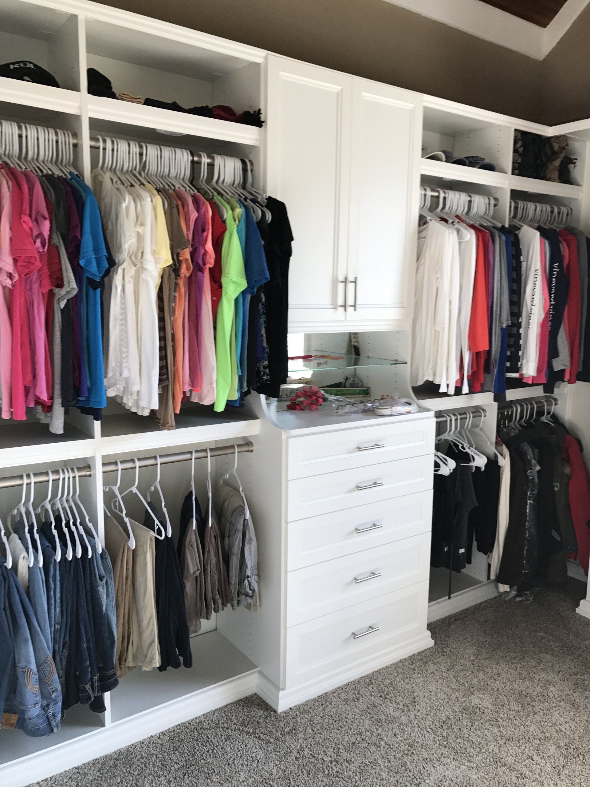 Custom Walk In Closet with a White Finish