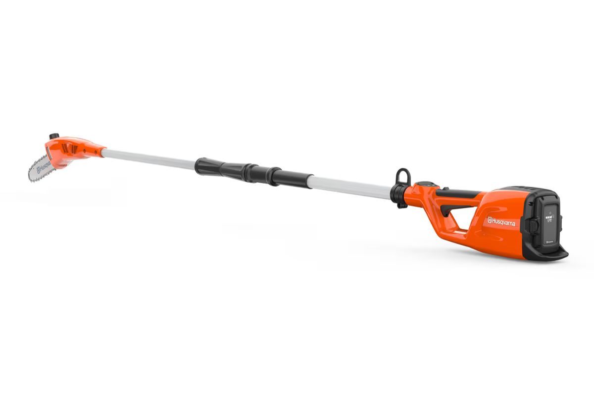 Orange and black battery-powered pole saw with extended arm, ready for tree pruning.