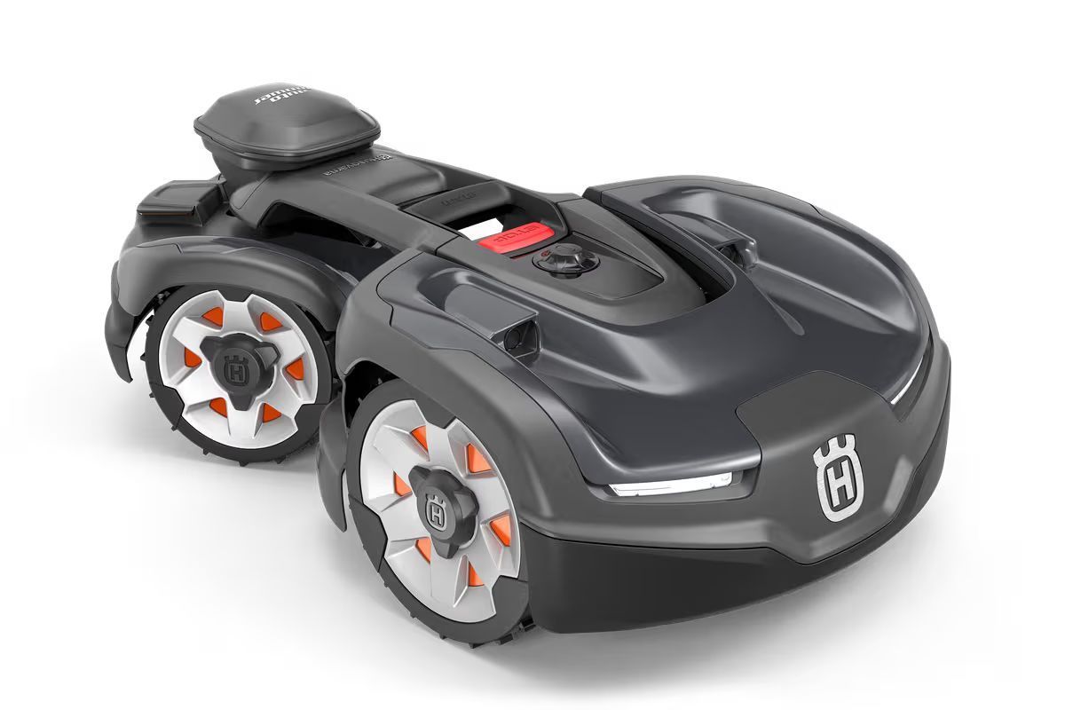 A dark gray Husqvarna robotic lawn mower on a white background.