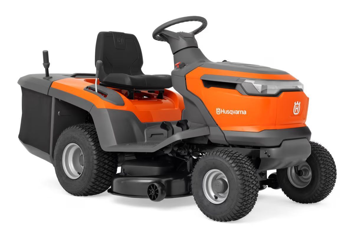 Orange Husqvarna riding lawnmower with black seat and grass catcher, on a white background.