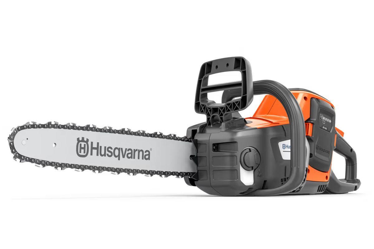 Husqvarna orange and black chainsaw with a silver blade, lying horizontally on white.
