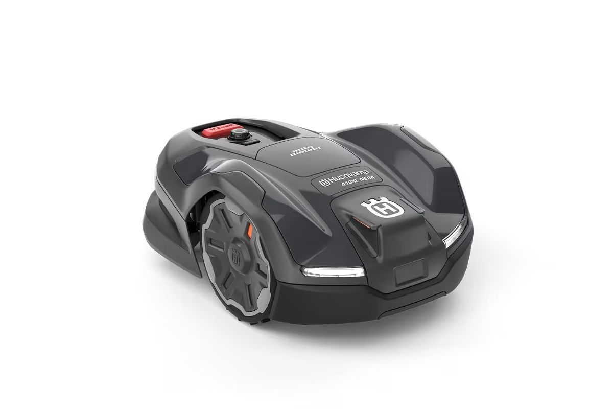 Dark gray Husqvarna robotic lawnmower on white background.