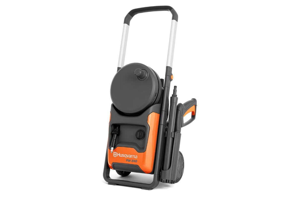 Orange and black pressure washer with a handle and wheels.
