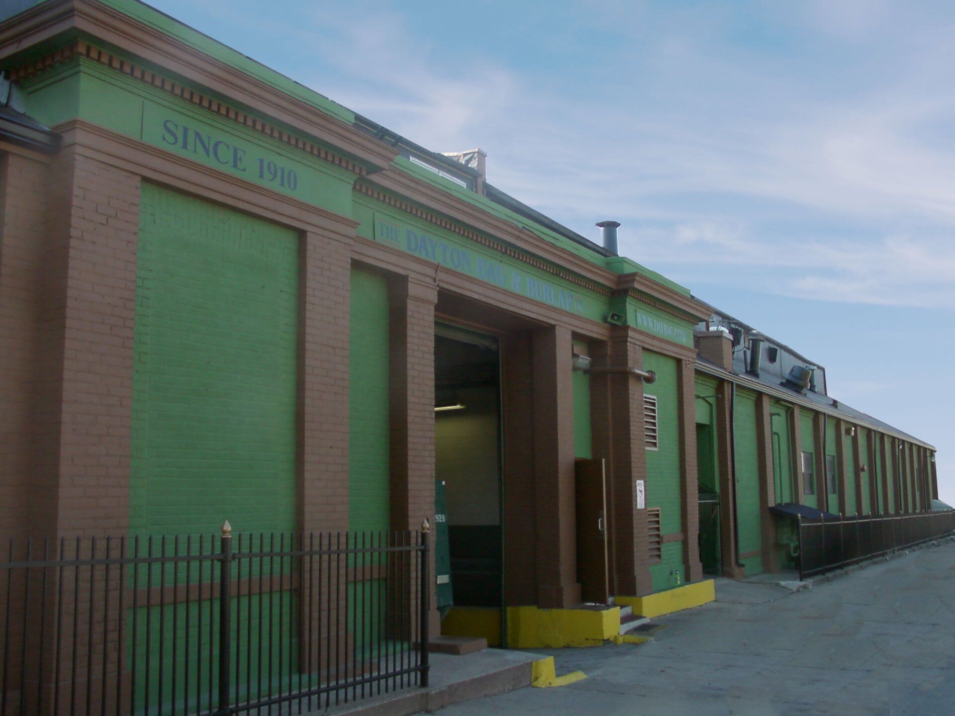 A green and brown building.