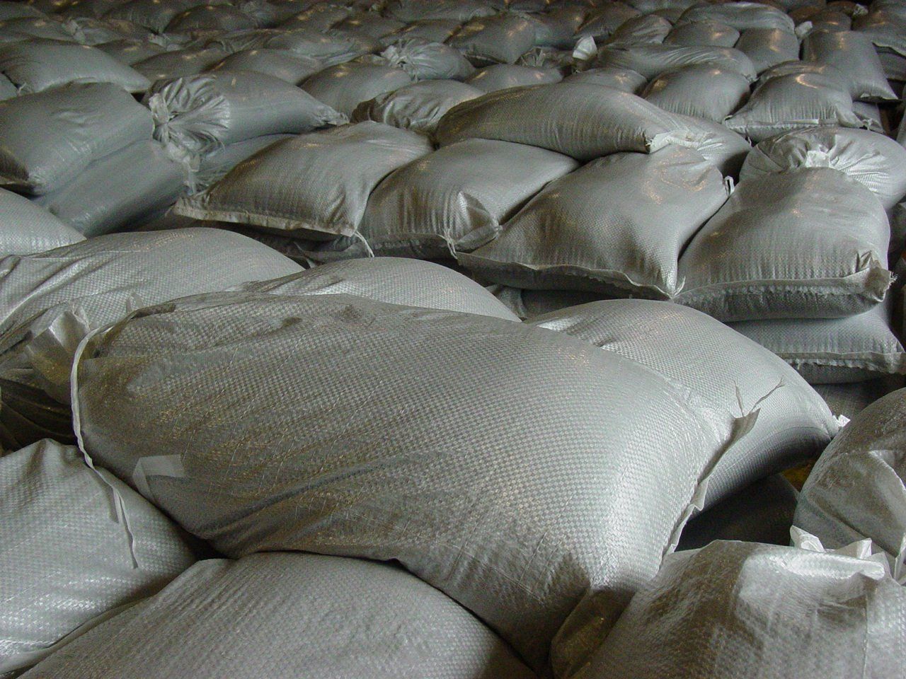 Multiple white sandbags.