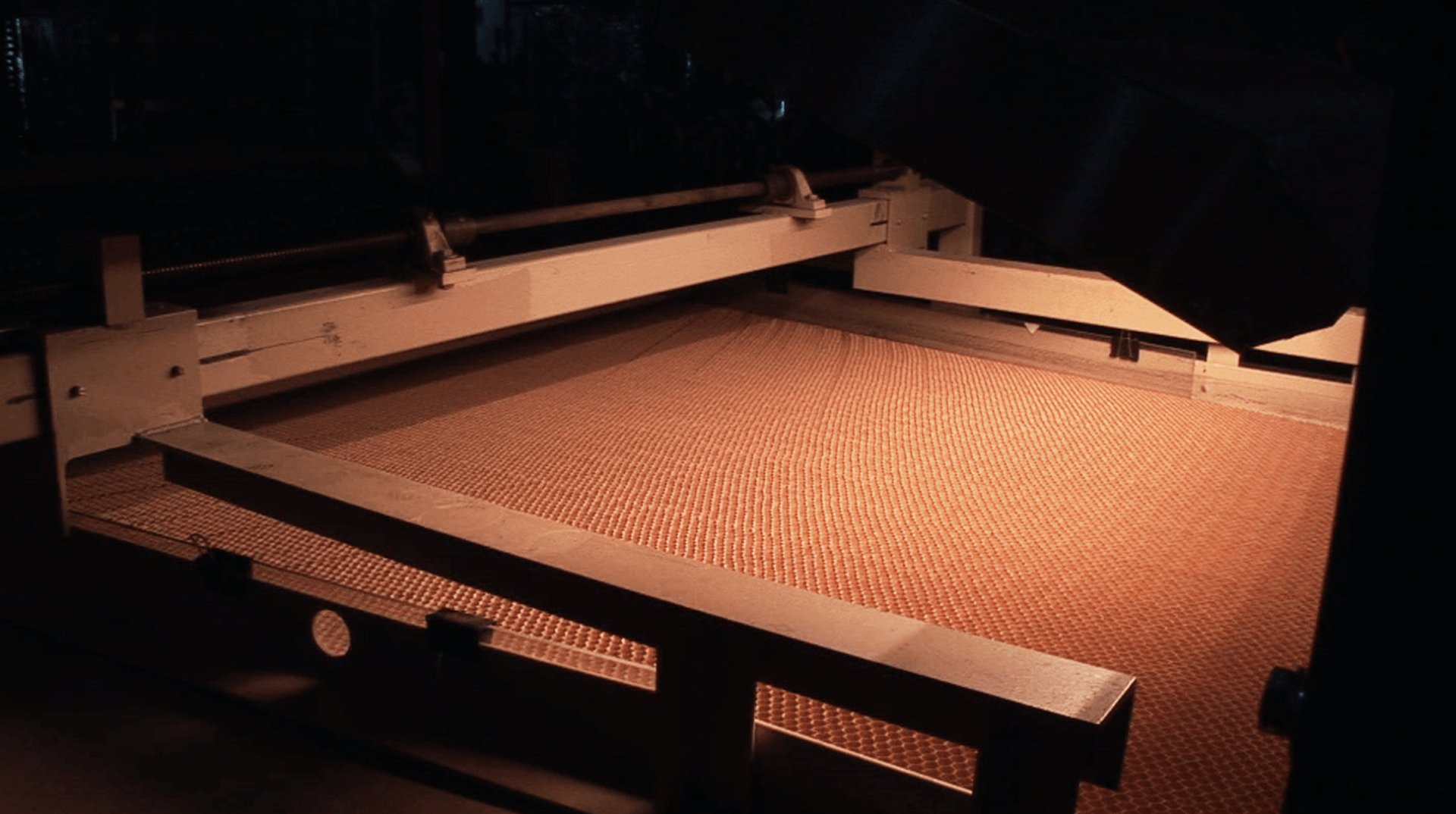 A machine working with material.