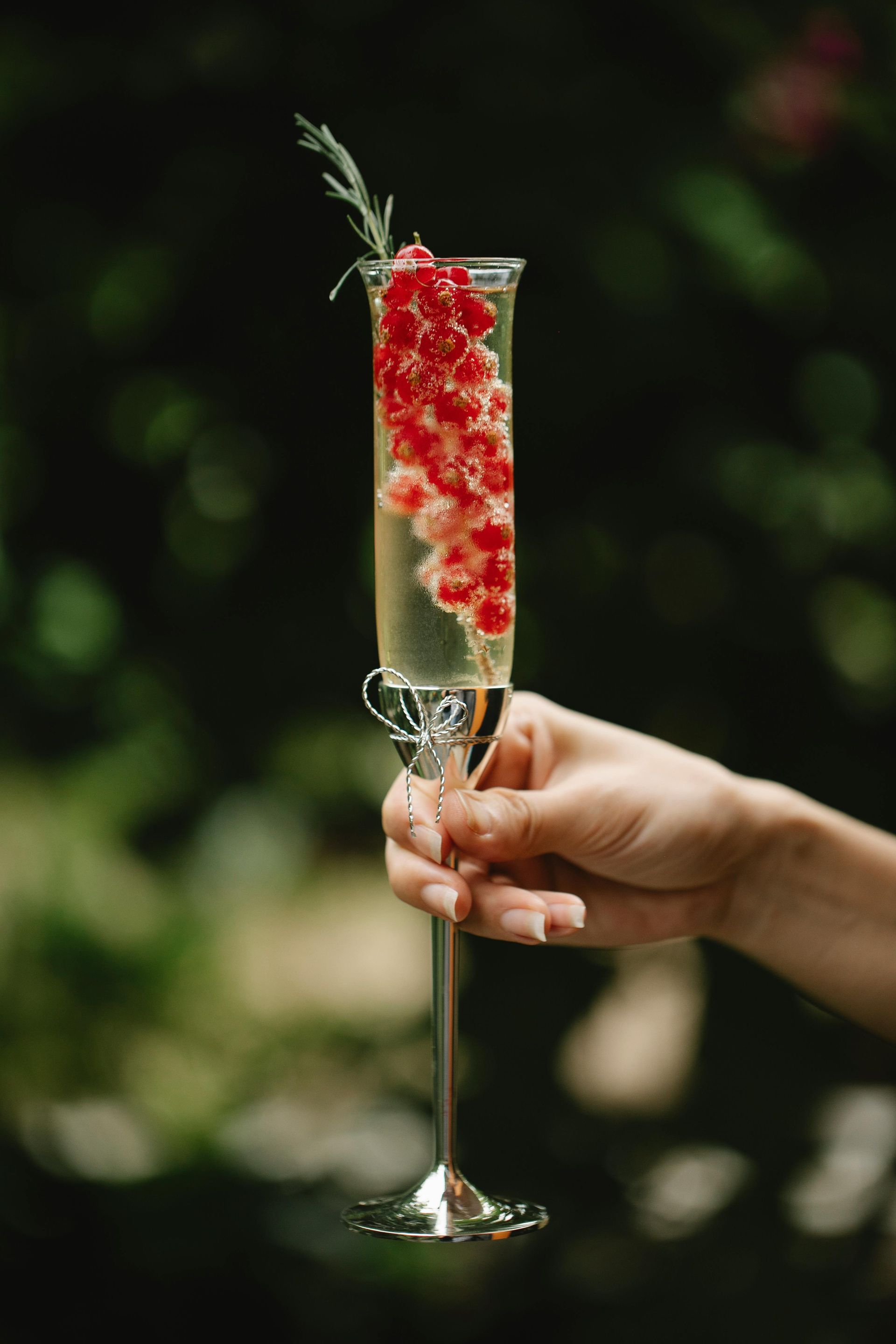 Lady holding a bubbly champers