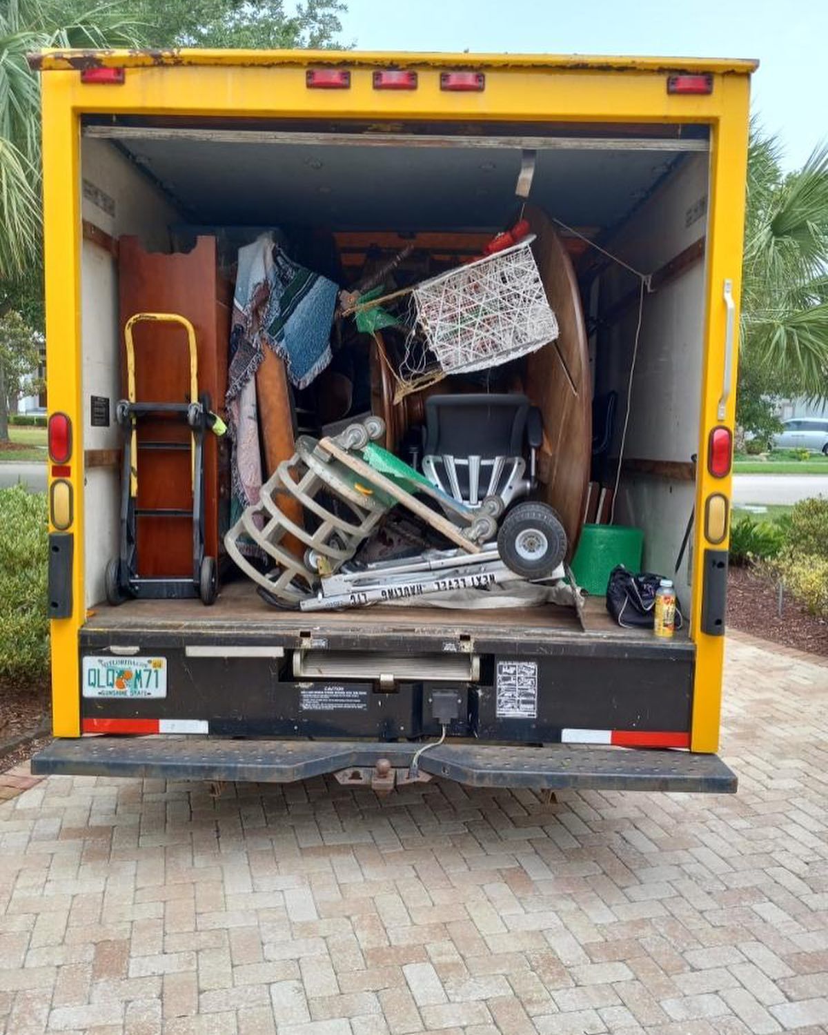 Empty room with light wood flooring, white walls, and a service counter.