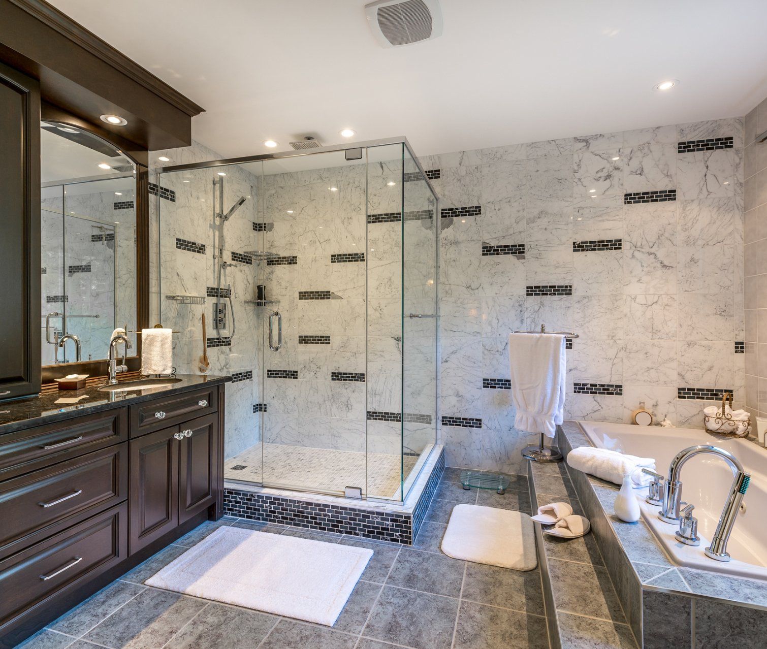 A bathroom with blue walls and white tiles