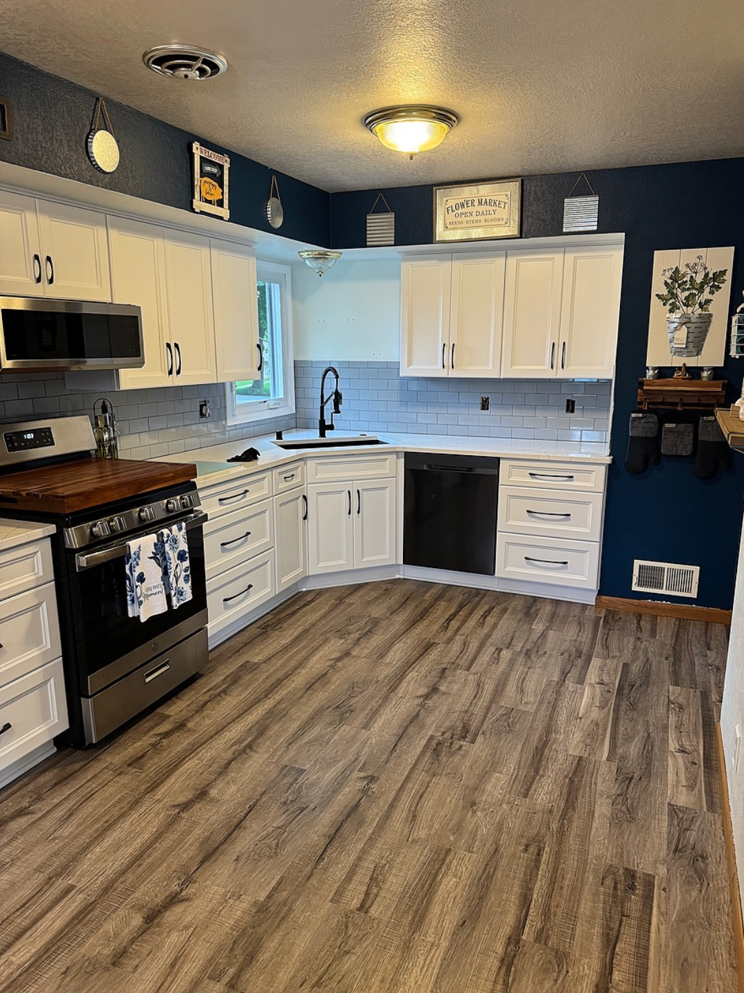 A large kitchen with a large island in the middle