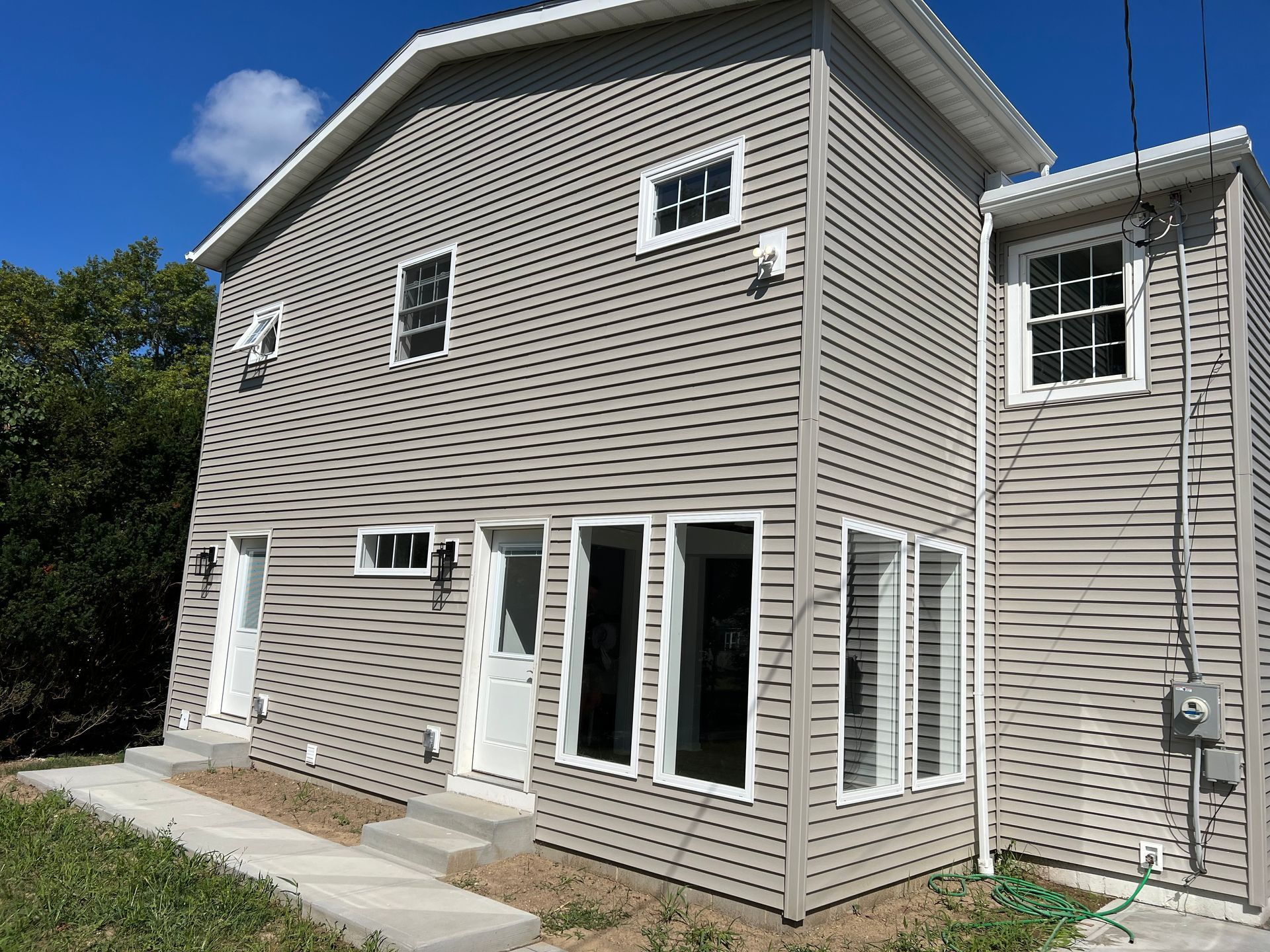 A large house with a lot of windows and stairs