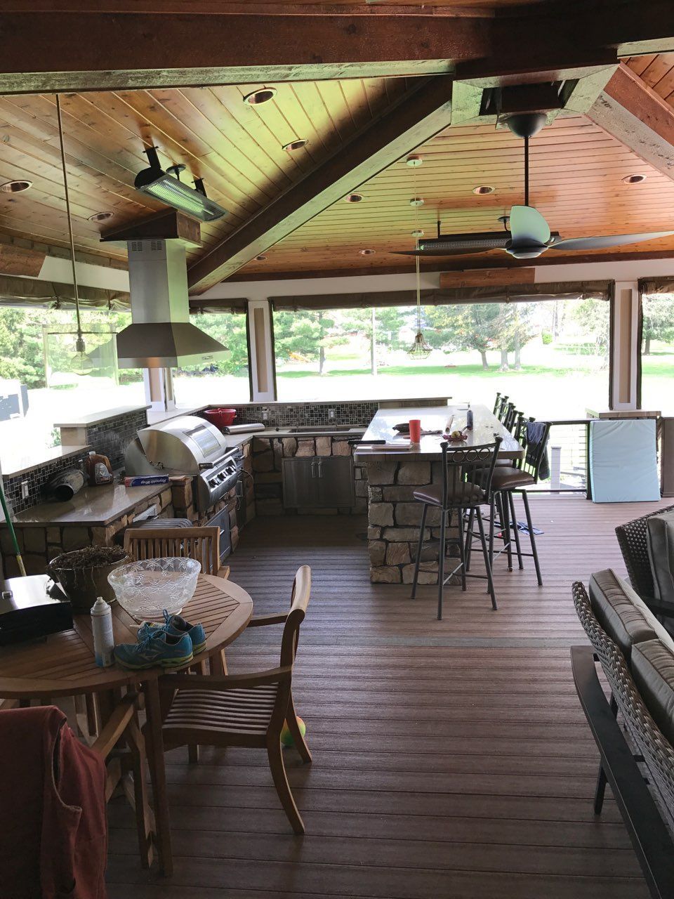 A large room with a lot of furniture and a ceiling fan.