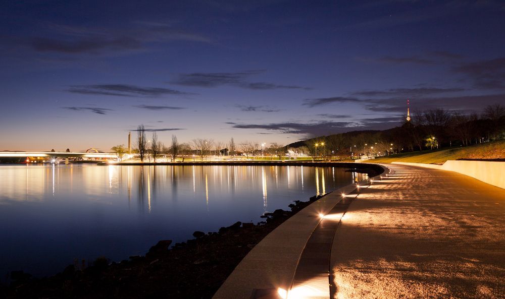 A Lake at Night With a Bridge in the Background — Illawarra Gardening Landscapes in Canberra, NSW