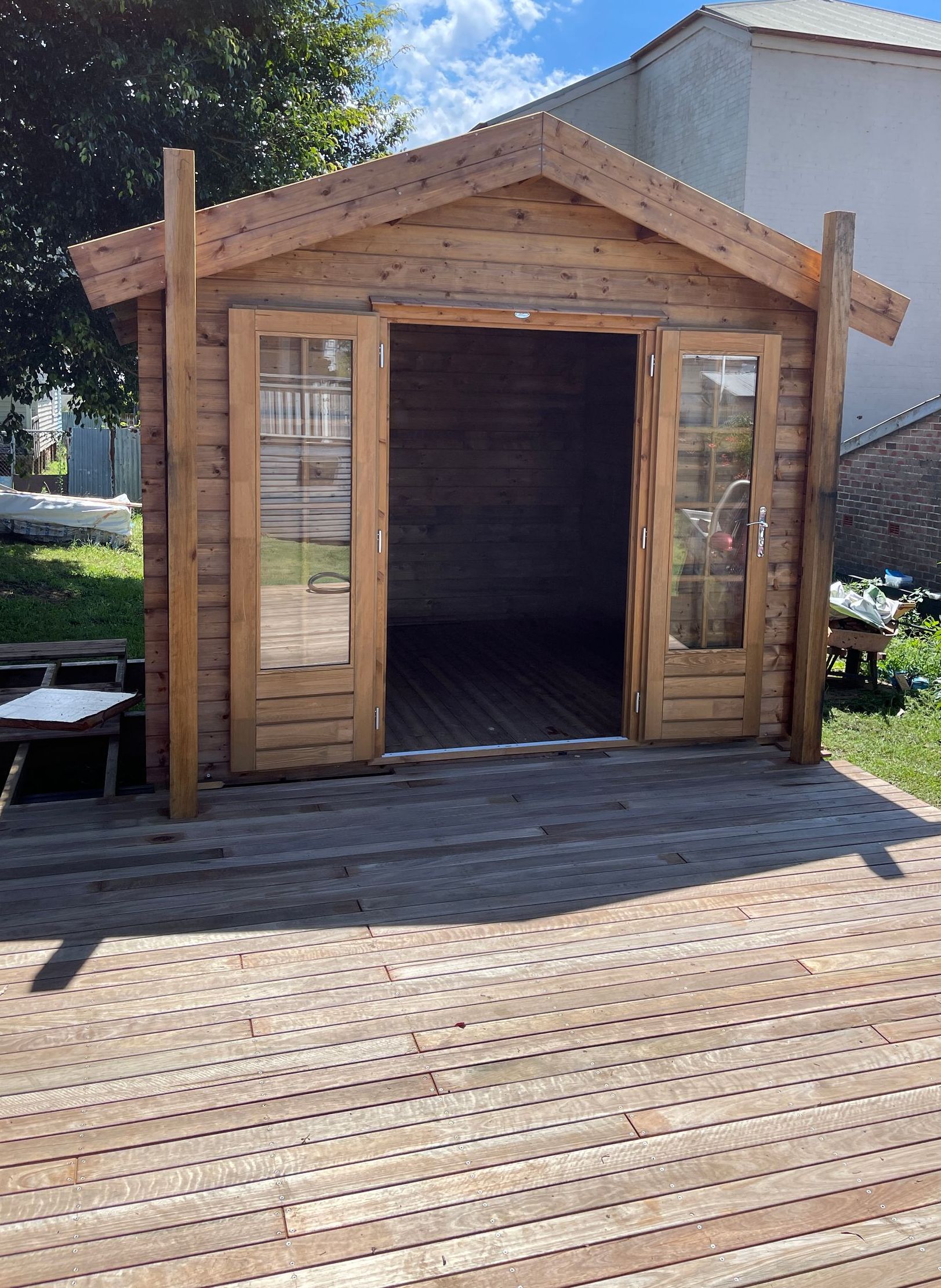 A Wooden Shed With a Wooden Deck in Front of It — Illawarra Gardening Landscapes in Southern Highlands, NSW