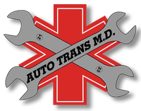 A logo for auto trans m.d. with a cross and two wrenches