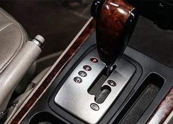 A close up of a shifter in a car.