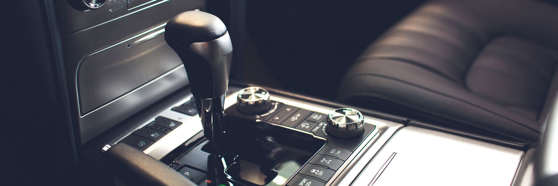 A close up of a shifter in a car.