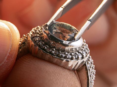 A security guard is walking down a hospital hallway.