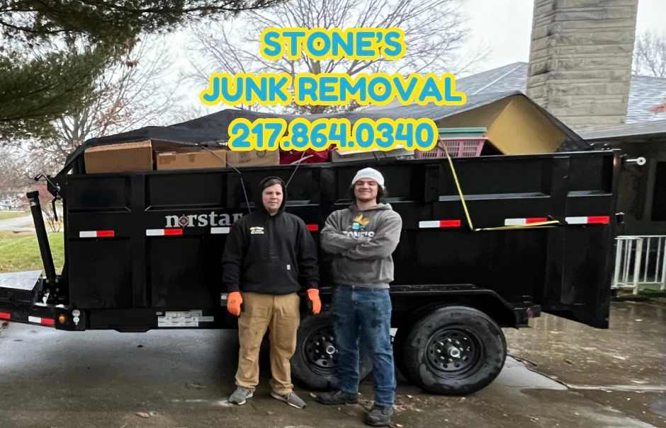 Two men standing in front of a dumpster that says stone 's junk removal