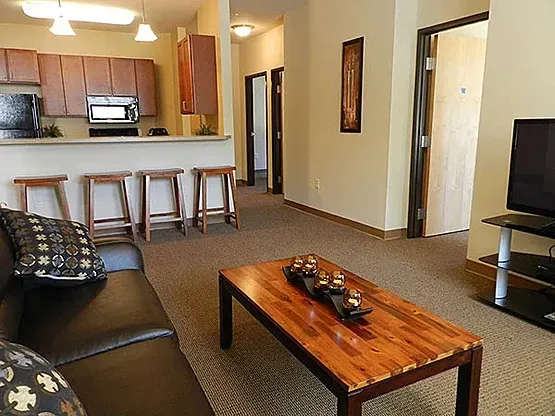 A living room with a couch and a coffee table