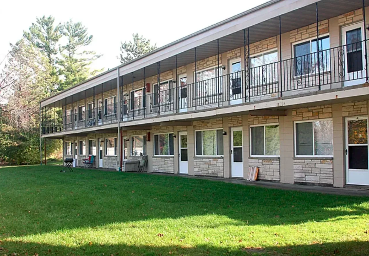 A large building with a lot of windows and doors