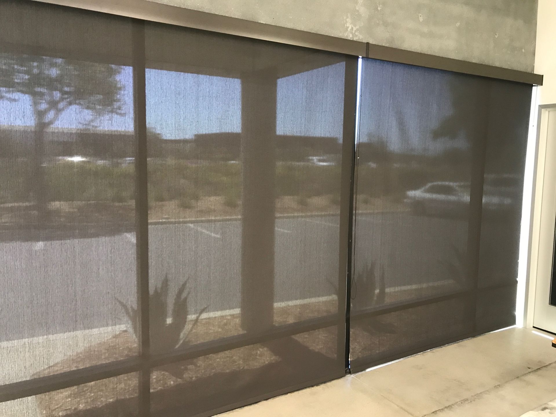 A large window with a lot of blinds on it