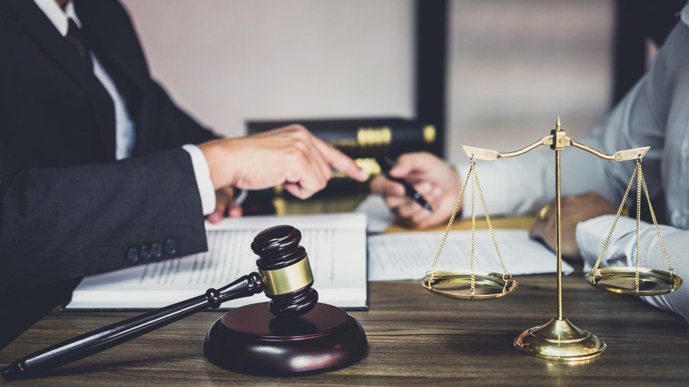 Lawyer Discussing Legal Contract With Client — Criminal Law Firm In Brisbane, QLD