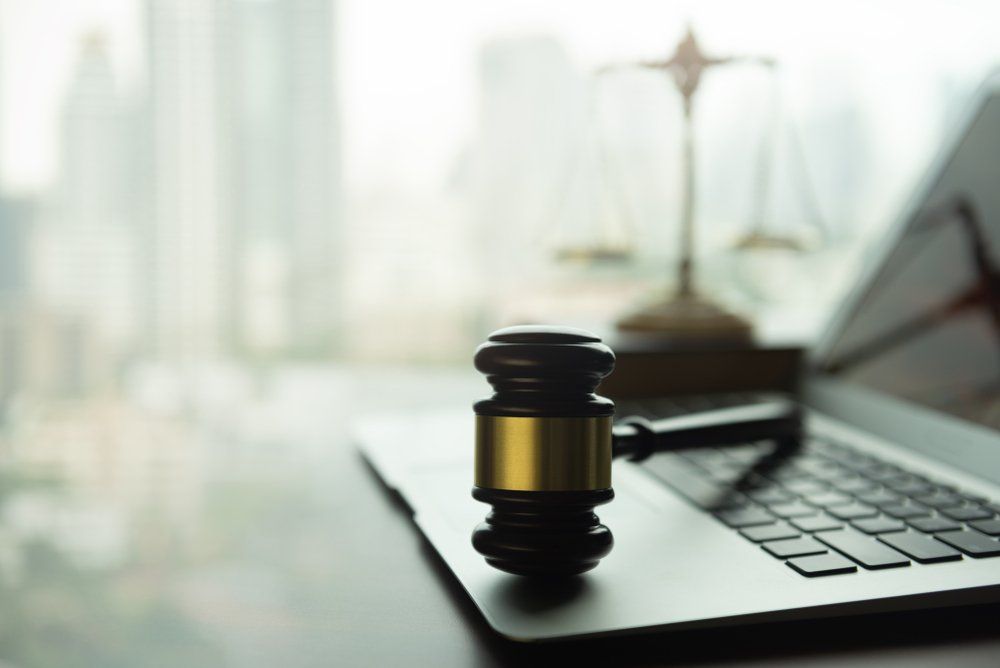 Judge Gavel And Laptop On A Desk — Criminal Law Firm In Brisbane, QLD