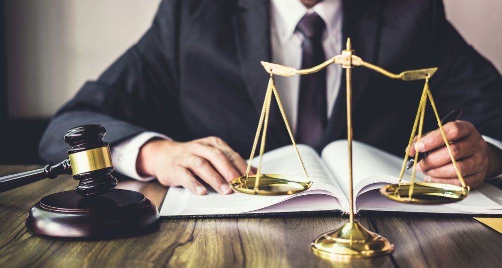 Scales Of Justice On Lawyer's Desk — Criminal Law Firm In Brisbane, QLD