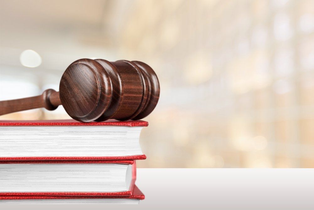 Judge's Gavel On Top Of Law Books — Criminal Law Firm In Brisbane, QLD